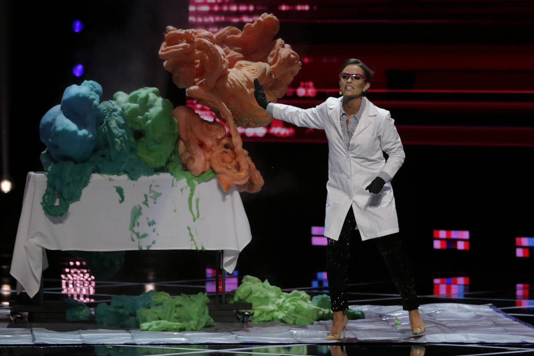 Camille Schrier, of Virginia, performs a science experiment prior to winning the Miss America c ...