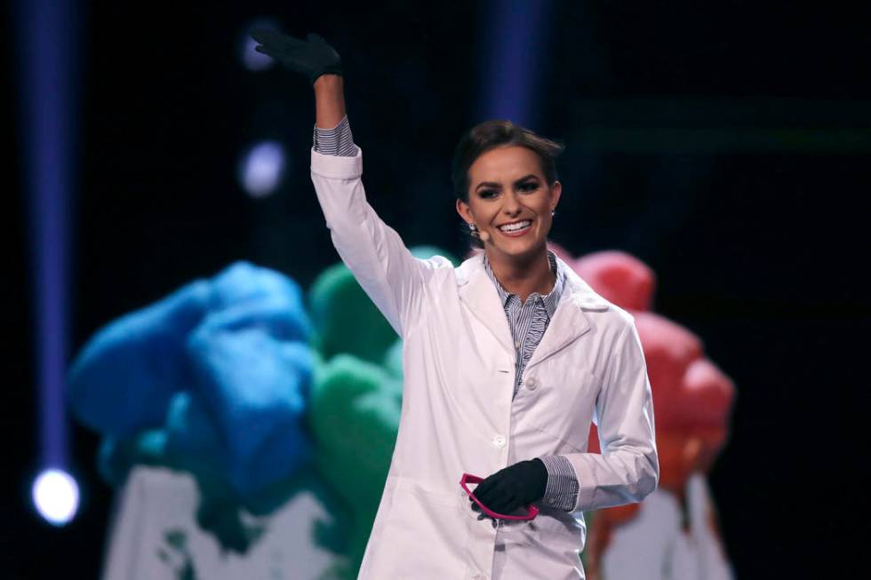 Camille Schrier, of Virginia, waves after performing a science experiment prior to winning the ...