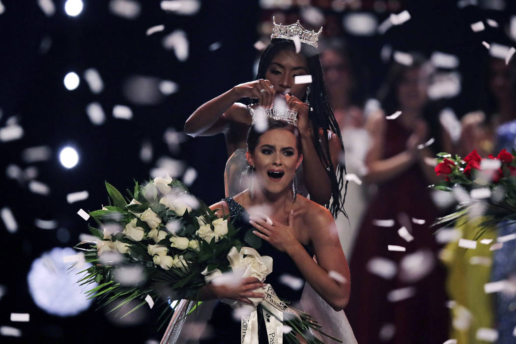 Camille Schrier, of Virginia, reacts as she is crowned after winning the Miss America competiti ...