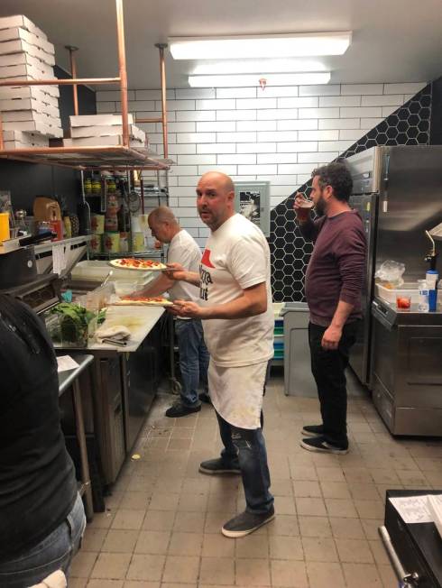 Chris Decker (center) makes pizzas during his pop-up at Sand Dollar Lounge on Sunday, December ...