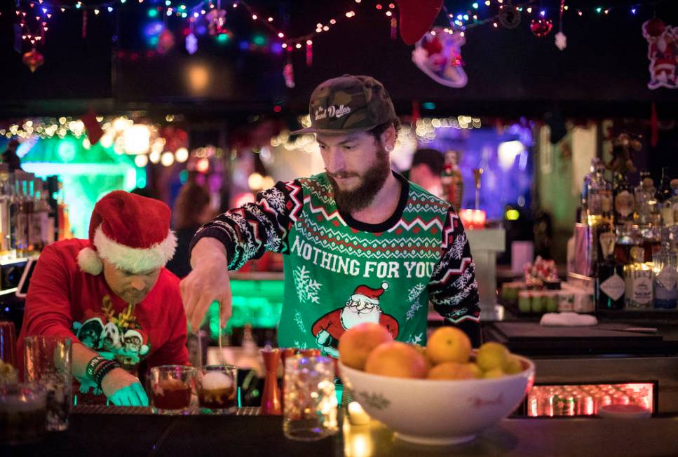 Bartenders Clint "Spotty" Spotleson, left, and Bryan Pierzga, right, mix drinks at th ...