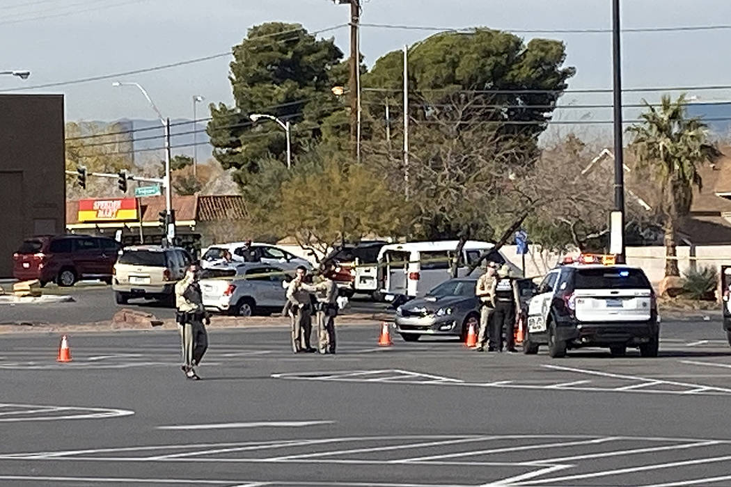 Police investigate a shooting in a Walmart parking lot near East Tropicana Avenue and McLeod Dr ...