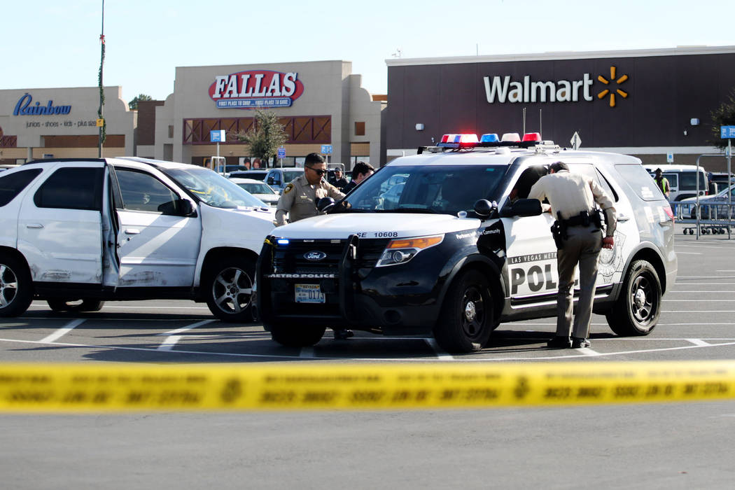 Police block off a parking lot near a Walmart Supercenter on the 3000 block of East Tropicana A ...