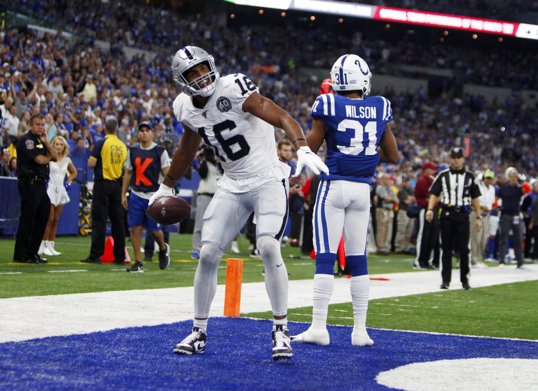 Oakland Raiders wide receiver Tyrell Williams (16) celebrates a touchdown score as defender Ind ...