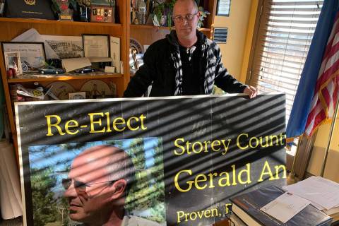 Storey County Sheriff Gerald Antinoro in his Virginia City office with one of his re-election c ...