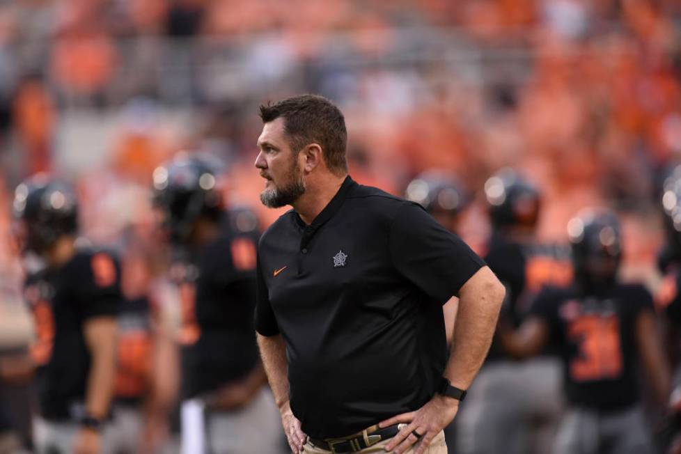 Oklahoma State defensive line coach Joe Bob Clements looks over his team during an NCAA college ...