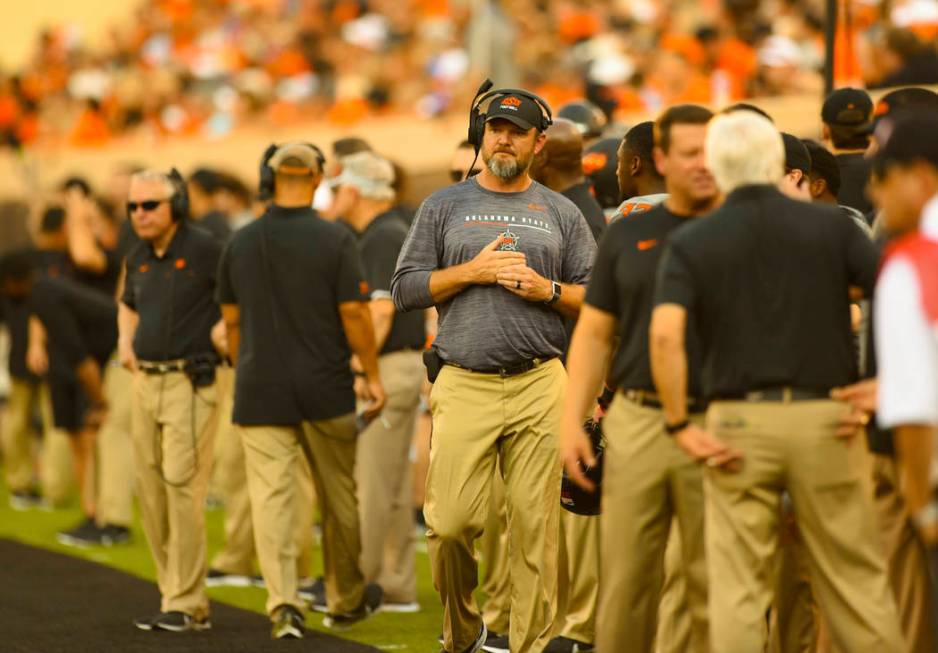 Oklahoma State defensive line coach Joe Bob Clements looks across the field during the first ha ...