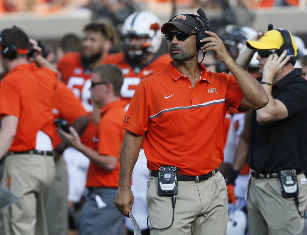 In this Saturday, Sept. 3, 2016 photo, Oklahoma State receivers coach Kasey Dunn is pictured on ...