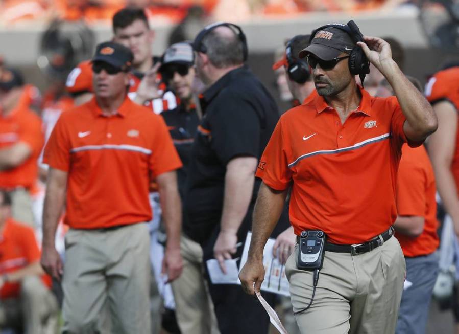 In this Saturday, Sept. 3, 2016 photo, Oklahoma State receivers coach Kasey Dunn is pictured on ...