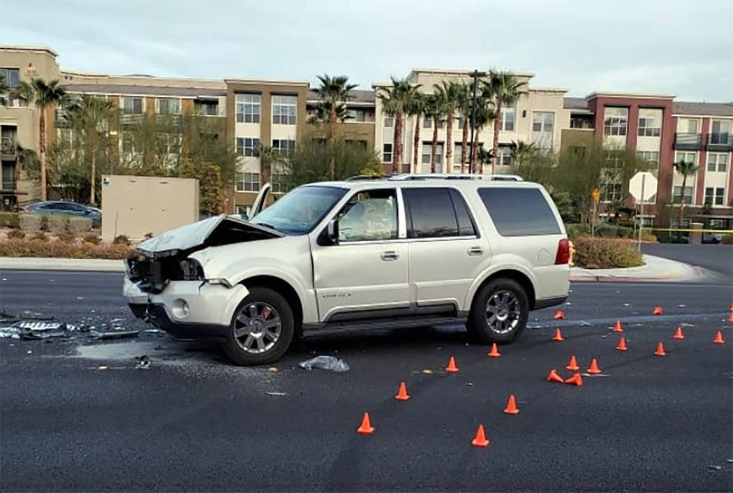 Officers respond to a fatal crash at Buffalo and Peak drives in Las Vegas on Saturday, Dec. 21, ...