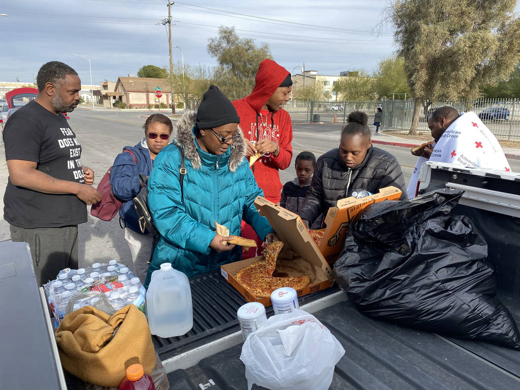 Residents, from left, Markas Combs, Tia Dotson, Stephanie Couch, Timothy Henry, Andru Roach, 7, ...