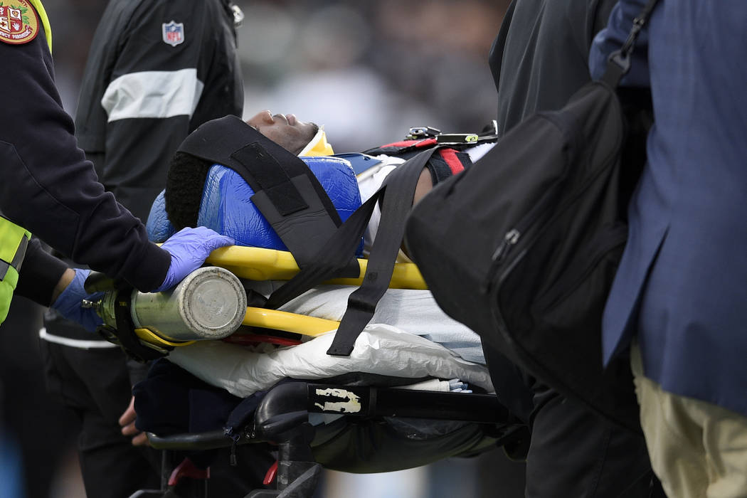 Oakland Raiders cornerback Trayvon Mullen is taken off the field after being hurt during the se ...