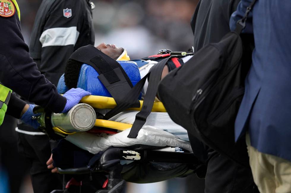 Oakland Raiders cornerback Trayvon Mullen is taken off the field after being hurt during the se ...