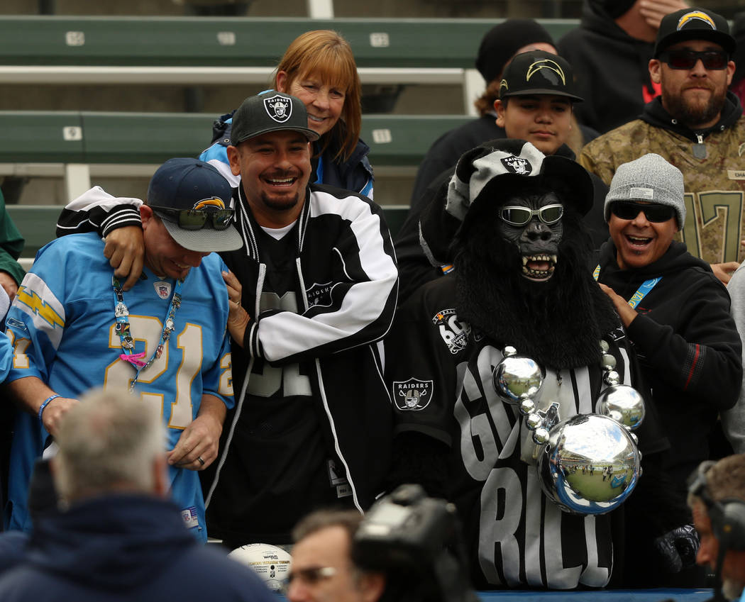 Oakland Raiders and Los Angeles Chargers fans before an NFL game between the Los Angeles Charge ...