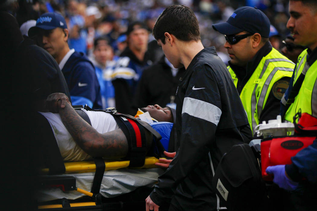 Oakland Raiders cornerback Trayvon Mullen is carted off the field on a gurney during the second ...
