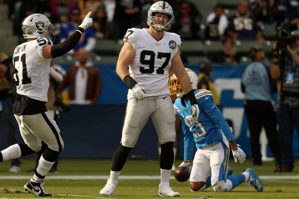 Oakland Raiders defensive end Josh Mauro (97) celebrates his tackle of Los Angeles Chargers wid ...