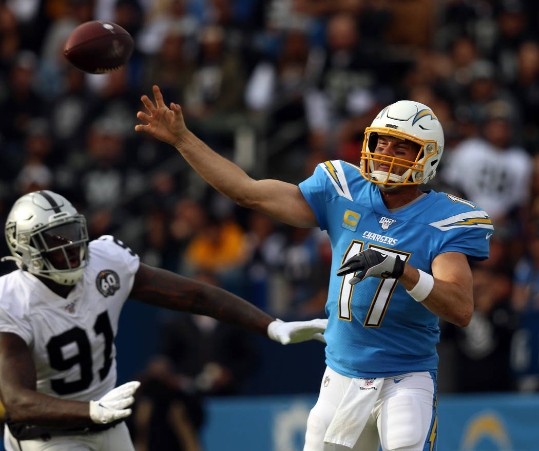 Los Angeles Chargers quarterback Philip Rivers (17) throws the football as Oakland Raiders defe ...