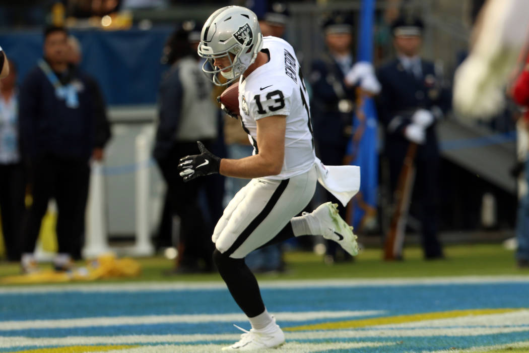 Oakland Raiders wide receiver Hunter Renfrow (13) scores a touchdown during the first half of a ...