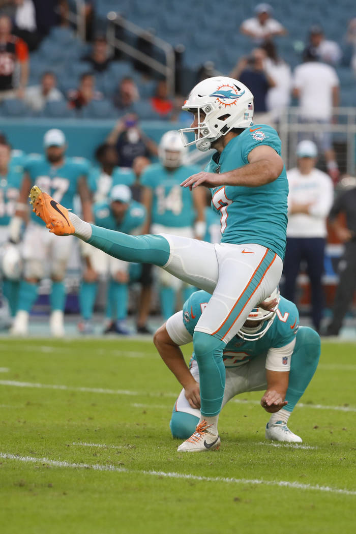 Miami Dolphins kicker Jason Sanders (7) kicks the game-winning field goal during overtime at an ...