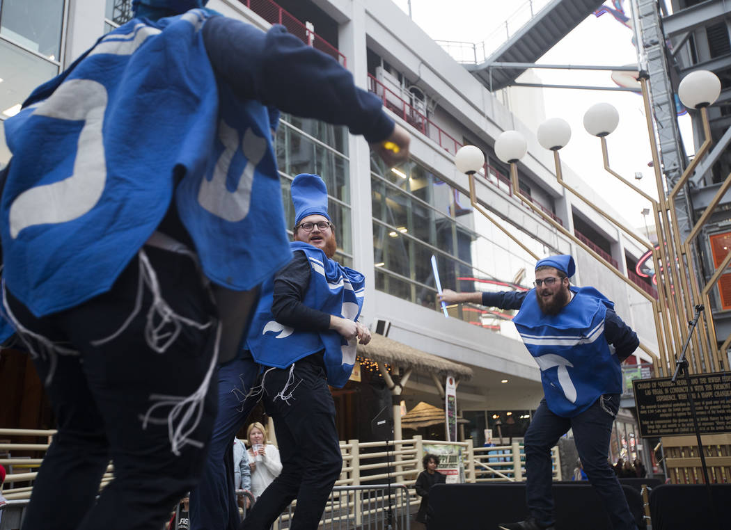 The Dancing Dreidels perform at a menorah lighting hosted by Chabad of Southern Nevada for the ...