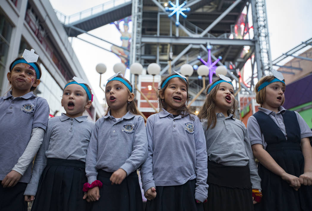 First graders from Desert Torah Academy Day School's choir sing for the crowd at a menorah ligh ...