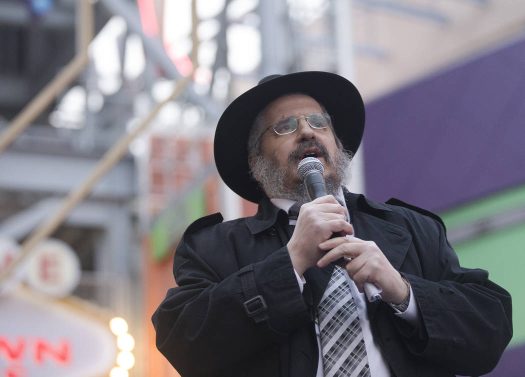 Rabbi Shea Harlig addresses the crowd at a menorah lighting hosted by the Chabada of Southern N ...