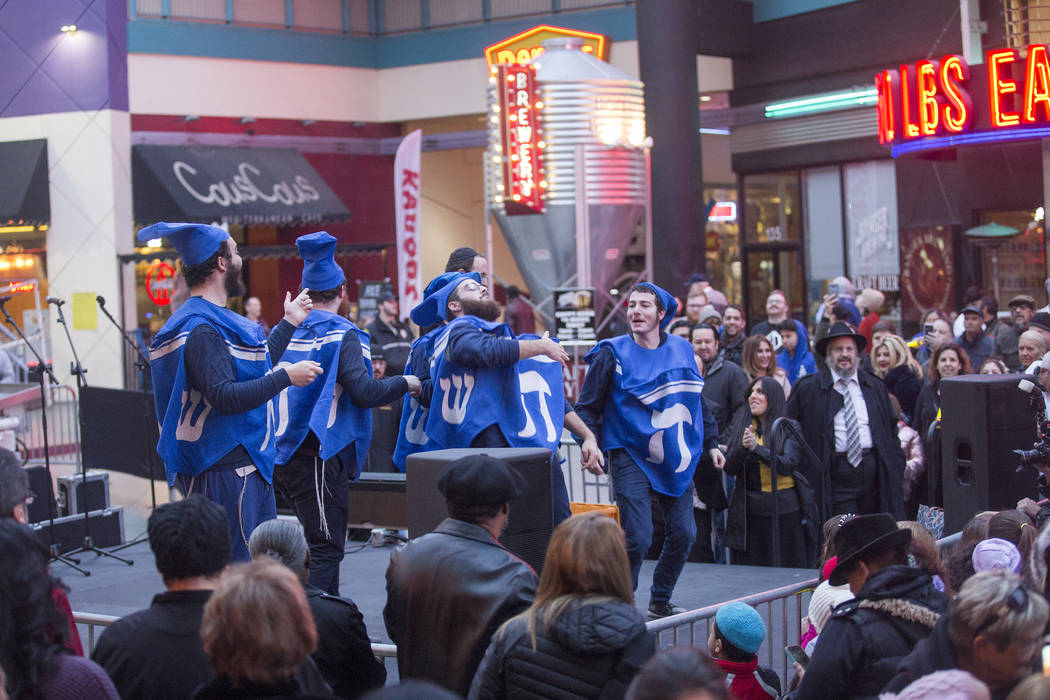 The Dancing Dreidels perform at a menorah lighting hosted by the Chabad of Southern Nevada for ...