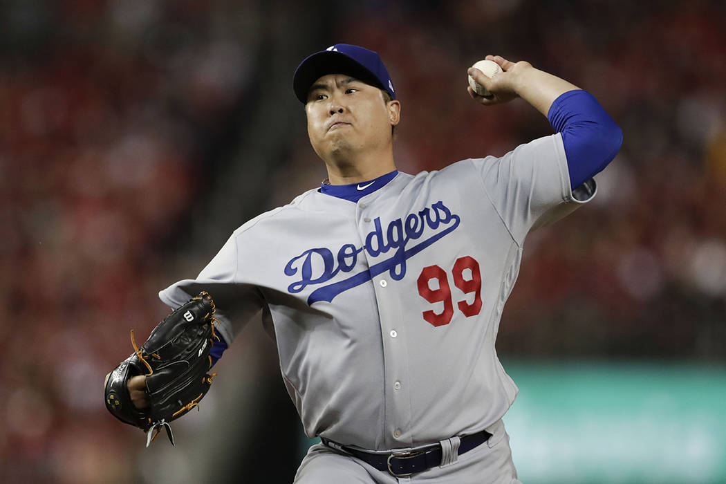 In this Oct. 6, 2019, file photo, Los Angeles Dodgers starting pitcher Hyun-Jin Ryu throws to a ...