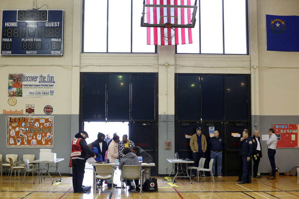 Individuals check into the Alpine Family Assistance Center at the Dula Gymnasium in Las Vegas o ...