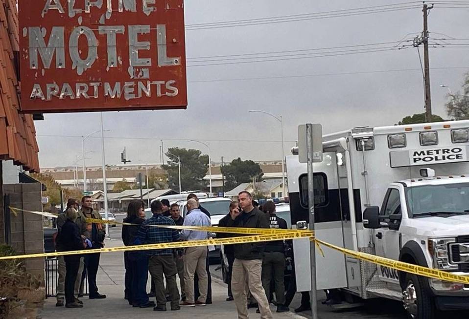 Officials gather in front of the Alpine Motel Apartments in advance of a news conference on Mon ...