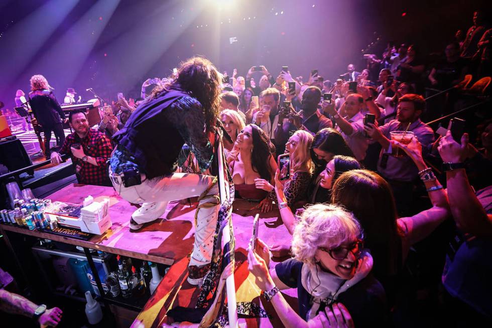 Steven Tyler of Aerosmith is shown performing on the bar in the onstage VIP section at Park The ...