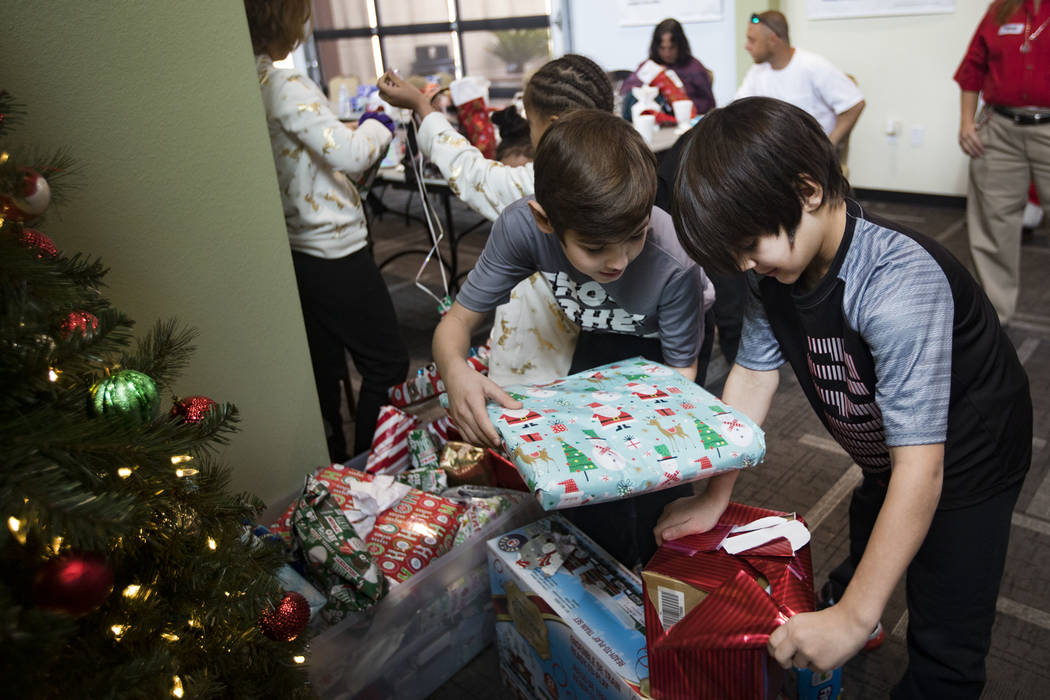 Michael Aikens, 8, left, and Miguel Rodriguez, 8, right, both survivors of the Alpine Motel fir ...