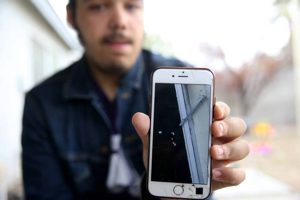 Jeremy Gordon, 18, on Tuesday, Dec. 24, 2019, shows a photo of the Alpine Motel Apartment's rea ...