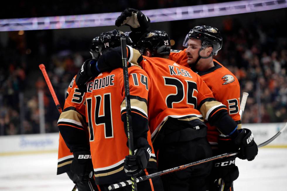 Anaheim Ducks' Adam Henrique (14) celebrates his goal with teammates during the second period o ...