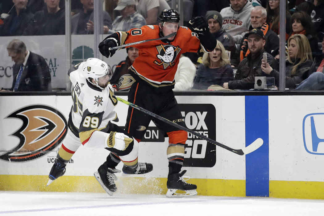 Anaheim Ducks' Nicolas Deslauriers, right, collides with Vegas Golden Knights' Alex Tuch (89) d ...