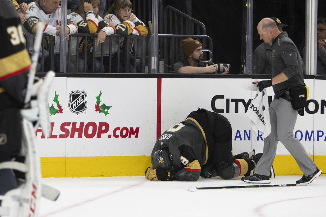 Vegas Golden Knights center Cody Glass (9) crouches in pain during the second period of the gam ...