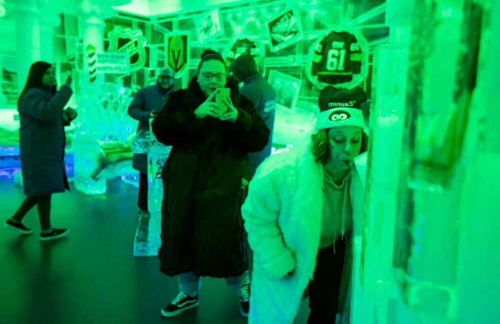 Marnie Lane takes a video as her mother, Ginny Lane, does a shot luge made of ice at ICEBAR Las ...