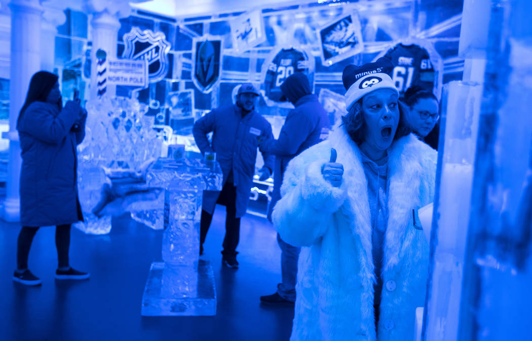 Ginny Lane cheers after doing a shot luge made of ice at ICEBAR Las Vegas in The LINQ Promenade ...