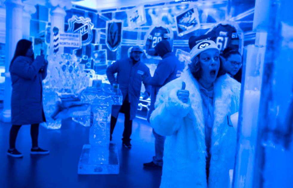 Ginny Lane cheers after doing a shot luge made of ice at ICEBAR Las Vegas in The LINQ Promenade ...