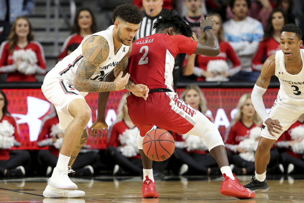 Cincinnati guard Jarron Cumberland (34) steals the ball from UNLV forward Donnie Tillman (2) du ...