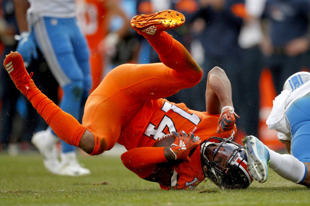 Denver Broncos wide receiver Courtland Sutton (14) is tackled by Detroit Lions cornerback Dariu ...