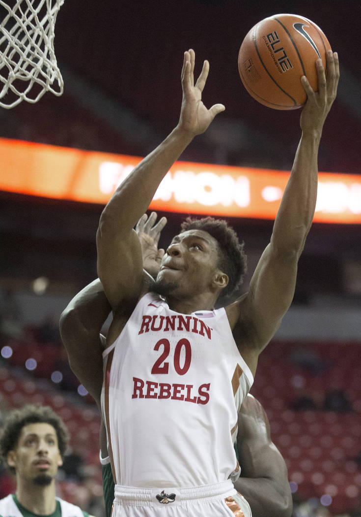 UNLV Rebels forward Donnie Tillman (2) drives past Eastern Michigan Eagles guard Noah Morgan (5 ...