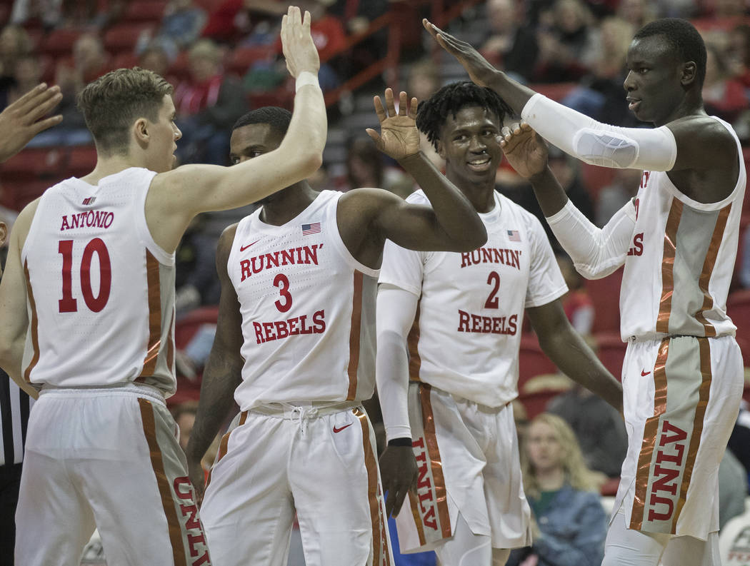 UNLV Rebels guard Jonah Antonio (10), UNLV Rebels guard Amauri Hardy (3), UNLV Rebels forward D ...