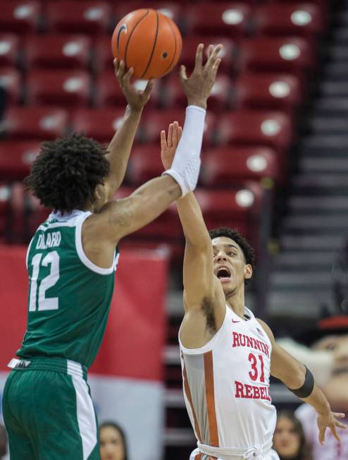 UNLV Rebels guard Marvin Coleman (31) extends to block the shot of Eastern Michigan Eagles guar ...