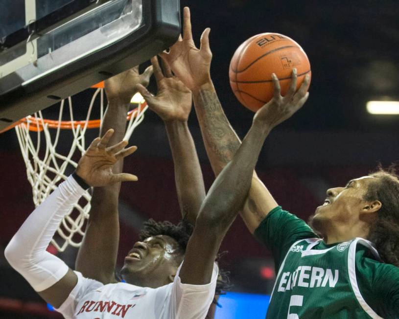 UNLV Rebels forward Donnie Tillman (2) drives over Eastern Michigan Eagles guard Noah Morgan (5 ...