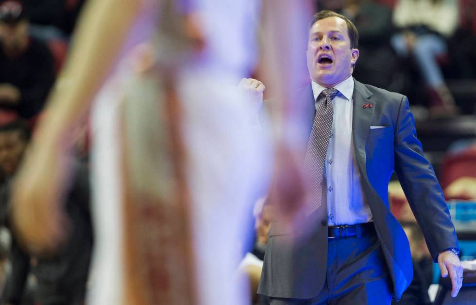 UNLV Rebels head coach T.J. Otzelberger calls out a play in the first half during an NCAA baske ...