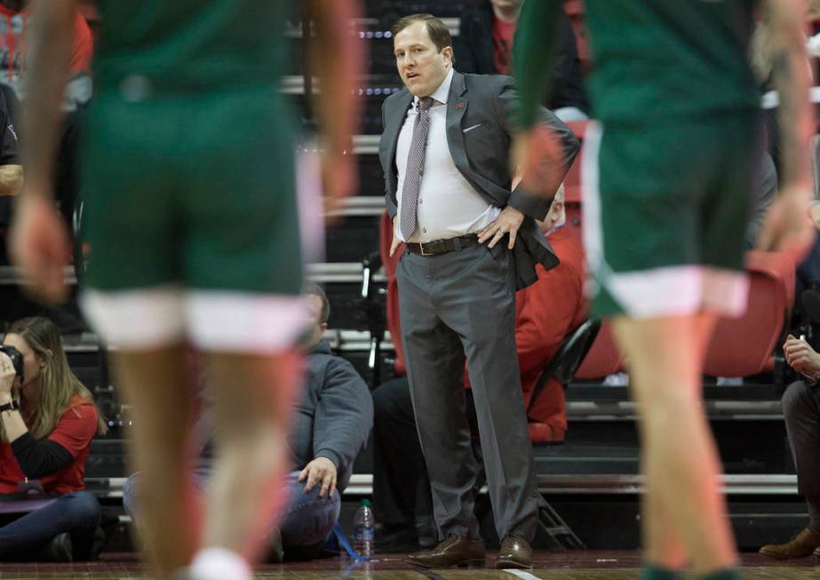 UNLV Rebels head coach T.J. Otzelberger watches over his team in the first half during an NCAA ...