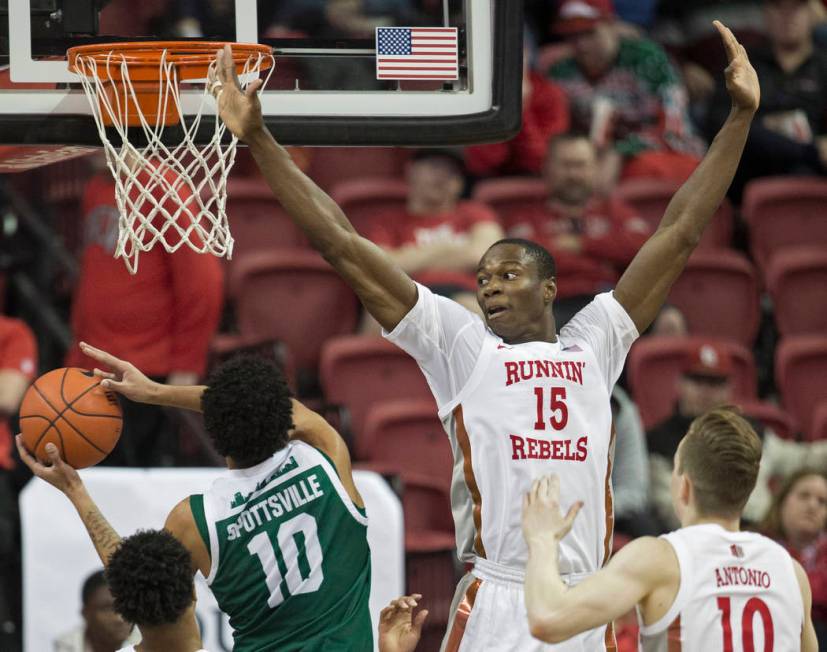 UNLV Rebels forward Cheickna Dembele (15) extends to block the shot of Eastern Michigan Eagles ...