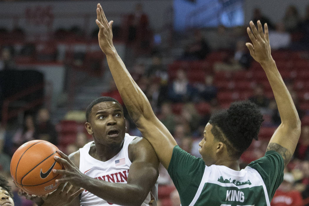 UNLV Rebels guard Amauri Hardy (3) drives to the rim past Eastern Michigan Eagles guard Shamar ...