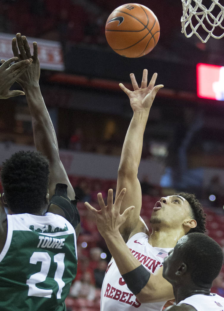 UNLV Rebels guard Marvin Coleman (31) shoots over Eastern Michigan Eagles center Boubacar Toure ...